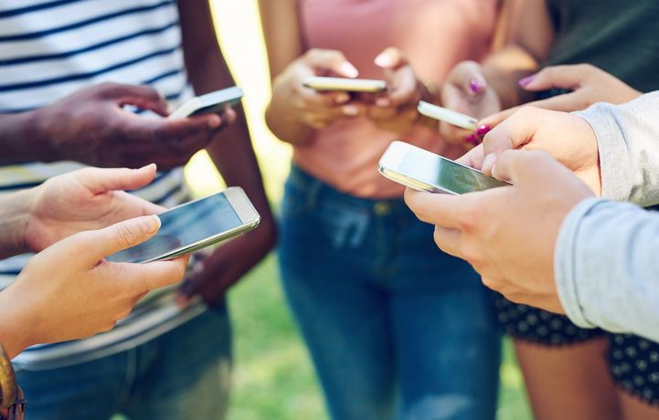 Group holding smartphones