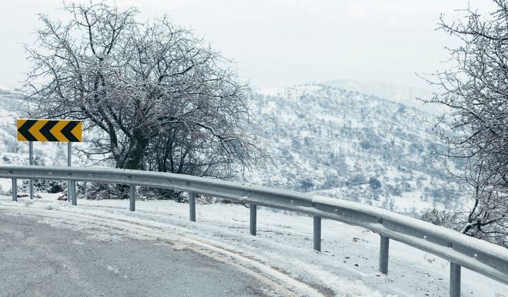 snowy curve in road