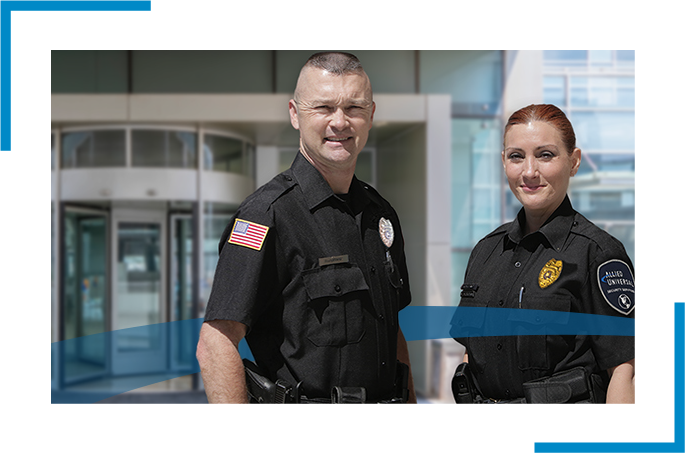 Two law enforcement officers standing in uniform