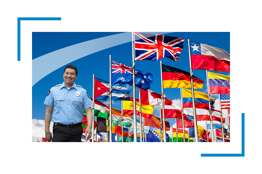 Security guard in front of national flags