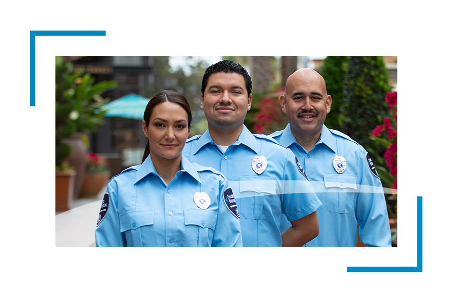 Three security professionals with badges