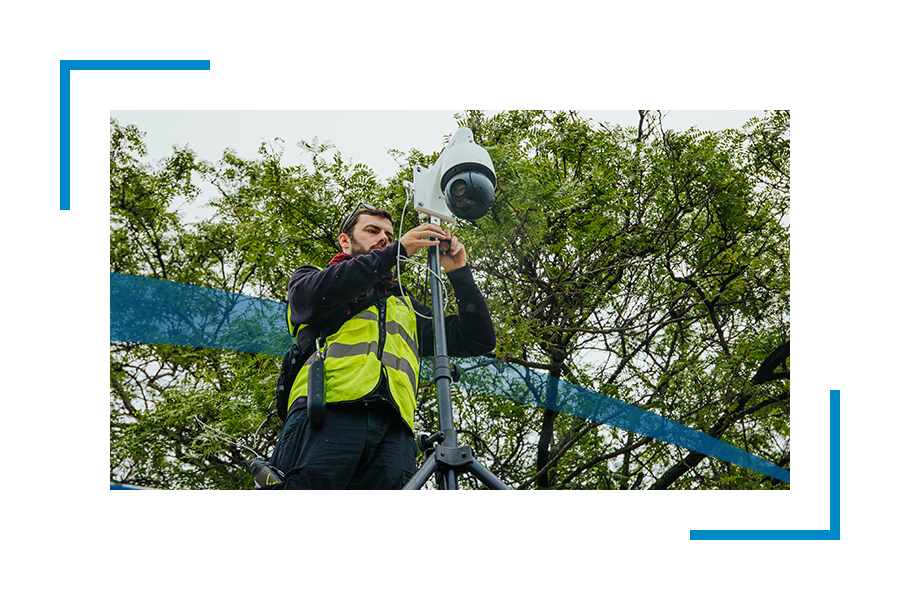 A person checking the surveillance camera