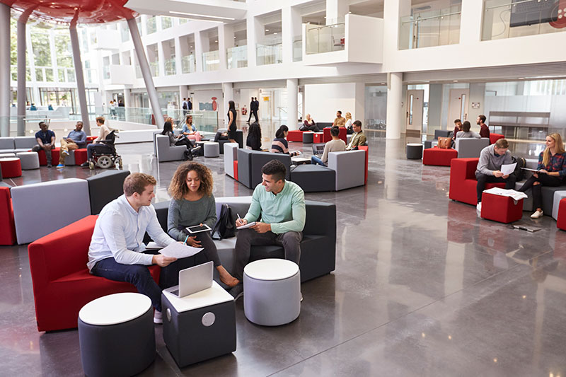 People sitting and having a meeting in a large open space