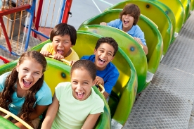 kids riding on roller coaster