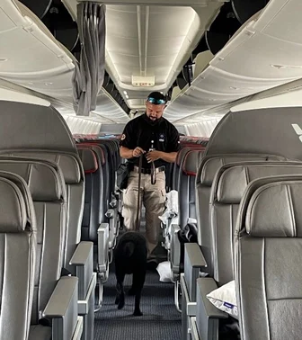 Man with canine in an airline