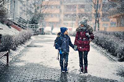 Kids walking in the snow