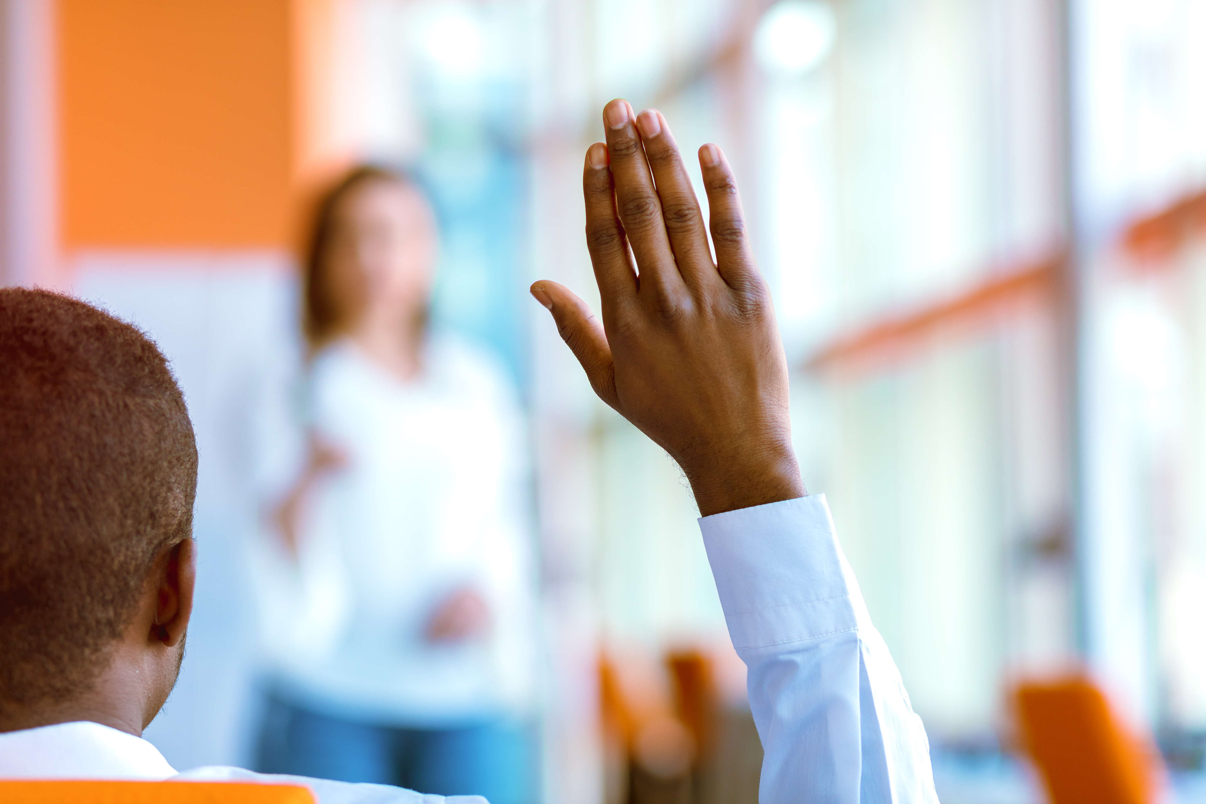 Man raising right hand to self advocate